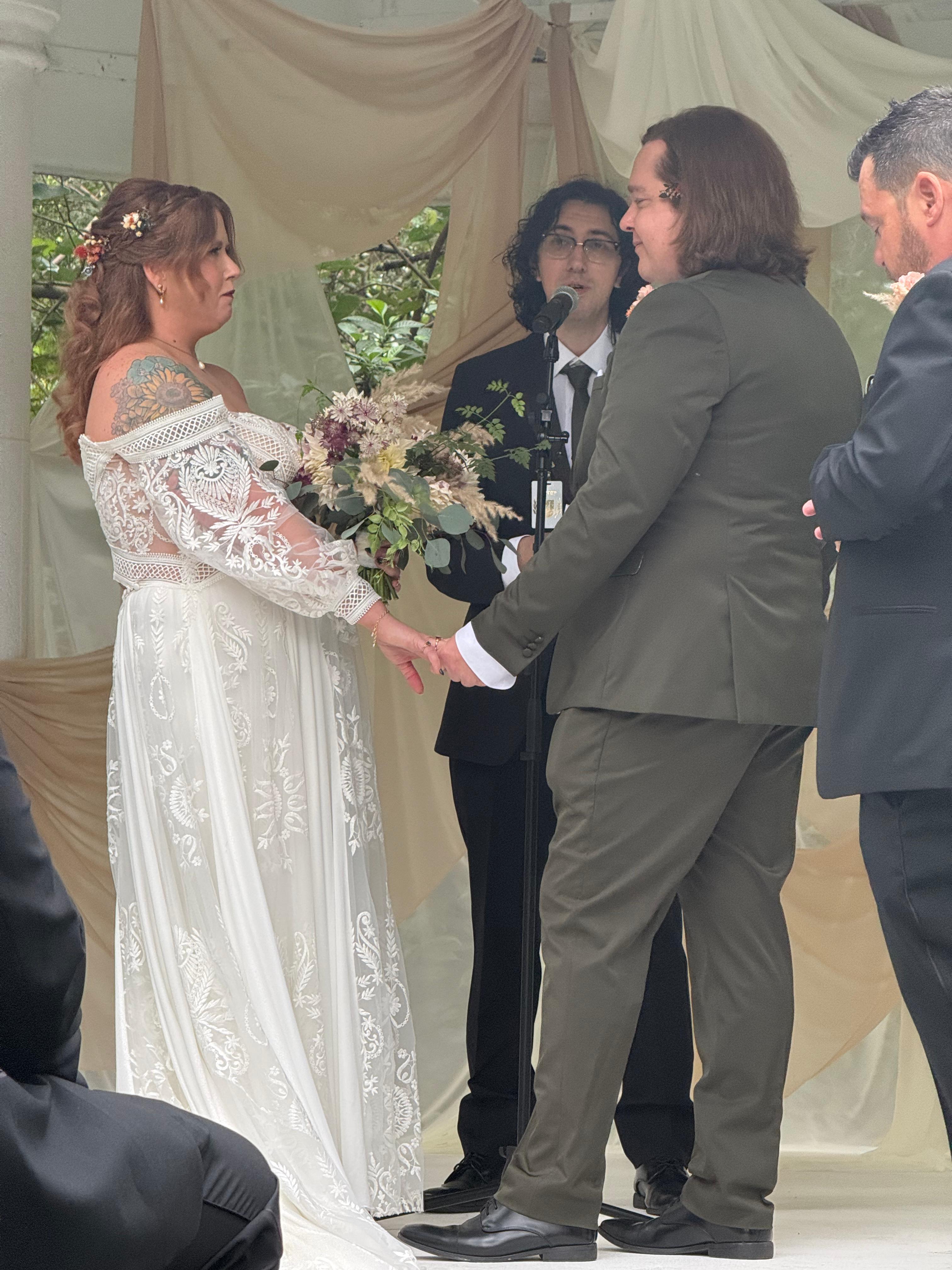 Husband and wife looking at the wedding cake.